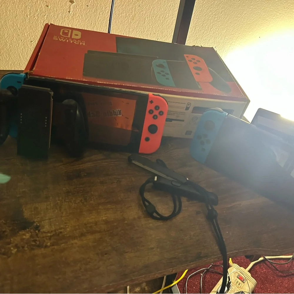 Nintendo Switch Console with Red and Blue Joy-Con Controllers